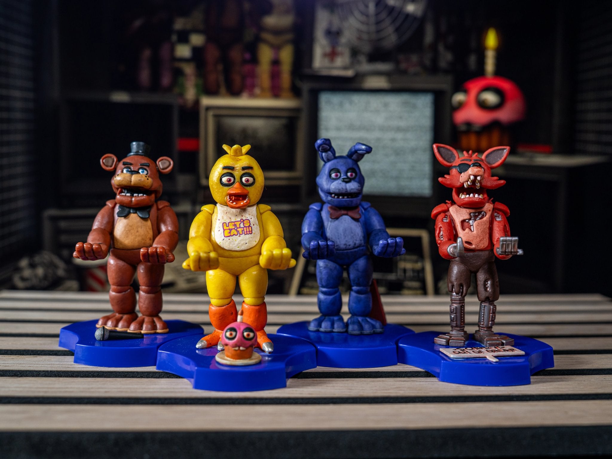 Five Nights at Freddy’s Mini Cable Guys figures displayed on blue stands.