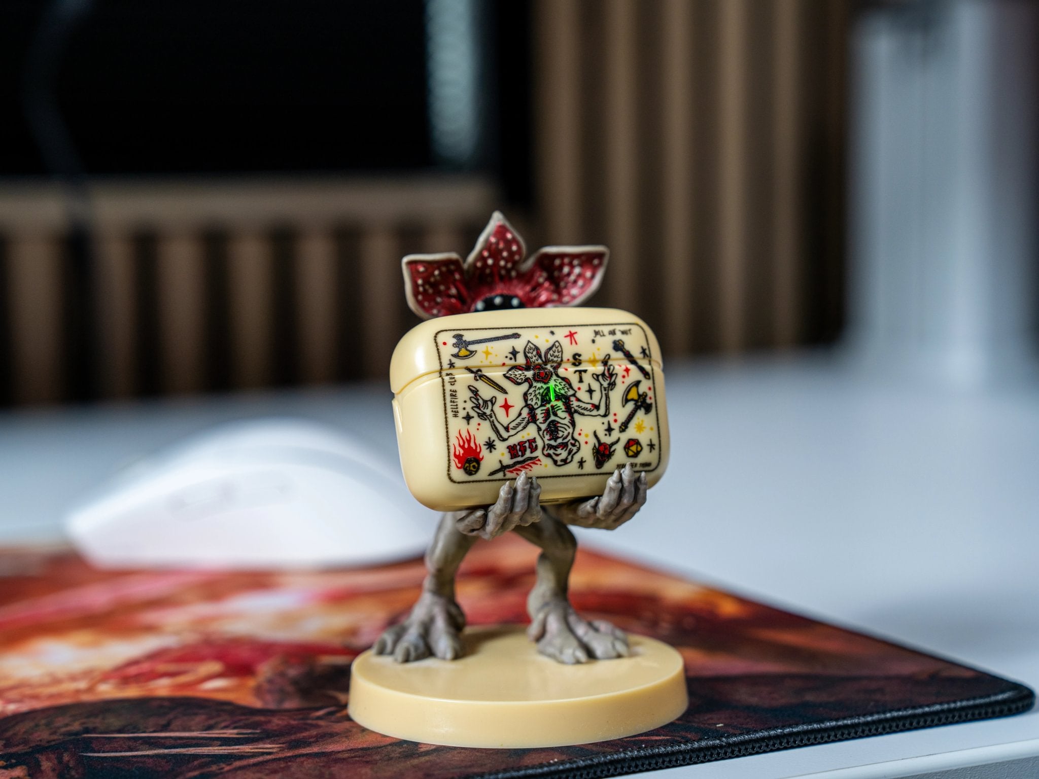 Stranger Things Demogorgon Mini Cable Guy holding a decorated device case